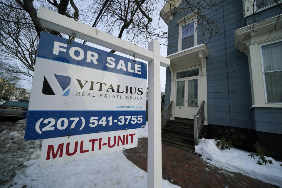 A sign announces a home for sale on Munjoy Hill, Wednesday, Jan. 25, 2023, in Portland, Maine. Over the past year, the Fed has raised its key short-term rate eight times, causing many kinds of consumer and business loans, including mortgages, to become more expensive.(AP Photo/Robert F. Bukaty)