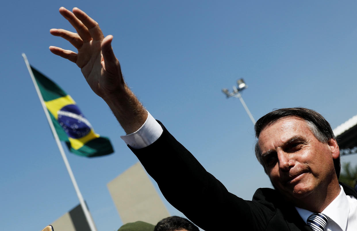Far-right candidate Jair Bolsonaro, a leading contender&nbsp;in Brazil's presidential&nbsp;race,&nbsp; waves during a military event earlier this year in Sao Paulo. Bolsonaro, a former Army officer, has praised the military dictatorship that ruled Brazil from 1964-1985. (Photo: Nacho Doce / Reuters)