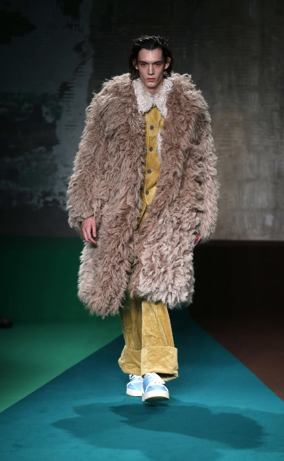 A model wears a creation for the Marni men's Fall-Winter 2017-2018 collection, part of the Milan Fashion Week, unveiled in Milan, Italy, Saturday, Jan. 14, 2017. (AP Photo/Antonio Calanni)