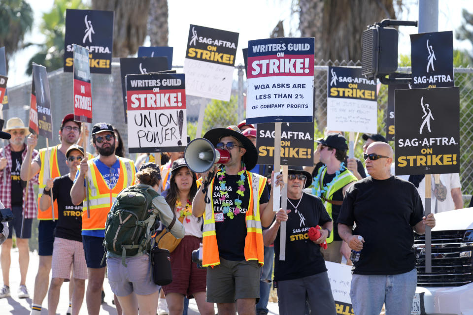 Striking writers and actors take part in a rally outside Netflix studio in Los Angeles on Friday, July 14, 2023. This marks the first day actors formally joined the picket lines, more than two months after screenwriters began striking in their bid to get better pay and working conditions. (AP Photo/Chris Pizzello)