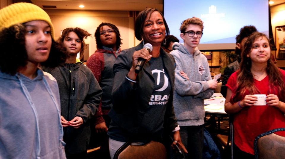 Urban Underground co-founder Sharlen Moore, center, moderates a segment of an Urban Underground program in 2018. Youths were invited to talk about conditions in their neighborhood.