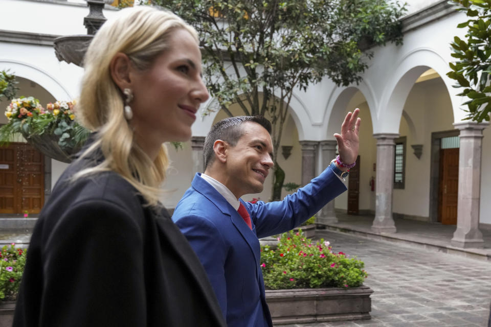 Ecuador's President Daniel Noboa waves upon his arrival with his wife Lavinia Valbonesi to Carondelet presidential palace in Quito, Ecuador, Friday, April 5, 2024. (AP Photo/Dolores Ochoa)