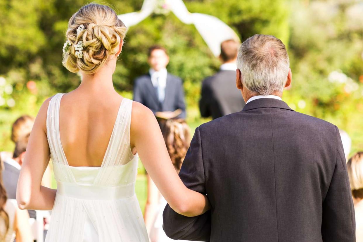 <p>Getty</p> stock image of a bride and her father