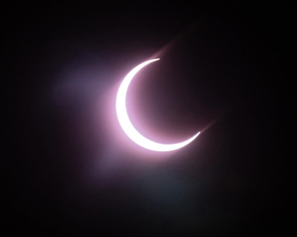 The eclipse as seen from the parking lot. The Cedar Ridge High School Band hosted the Texas Marching Classic at Kelly Reeves Stadium in Round Rock on October 14, 2023. There was a lunch/solar eclipse break for the annular solar eclipse just before noon.