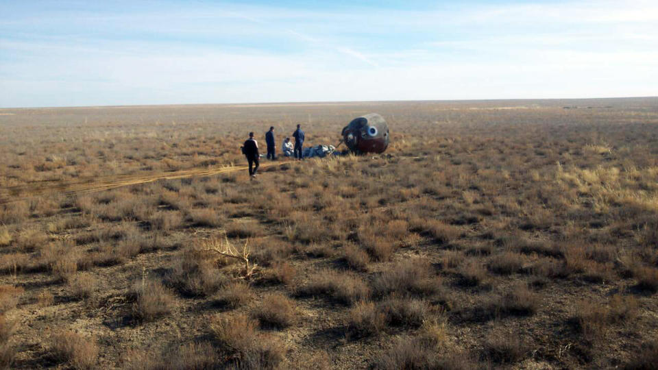 In this photo provided by Russian Defense Ministry Press Service, the Soyuz MS-10 space capsule lays in a field after an emergency landing near Dzhezkazgan, about 450 kilometers (280 miles) northeast of Baikonur, Kazakhstan, Thursday, Oct. 11, 2018. NASA astronaut Nick Hague and Roscosmos' Alexei Ovchinin lifted off as scheduled at 2:40 p.m. (0840 GMT; 4:40 a.m. EDT) Thursday from the Russian-leased Baikonur cosmodrome in Kazakhstan, but their Soyuz booster rocket failed about two minutes after the launch. (Russian Defense Ministry Press Service photo via AP)