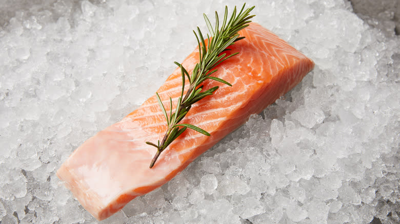 salmon with rosemary on ice