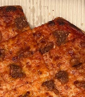 Terita's sausage pizza, minus the corner piece.