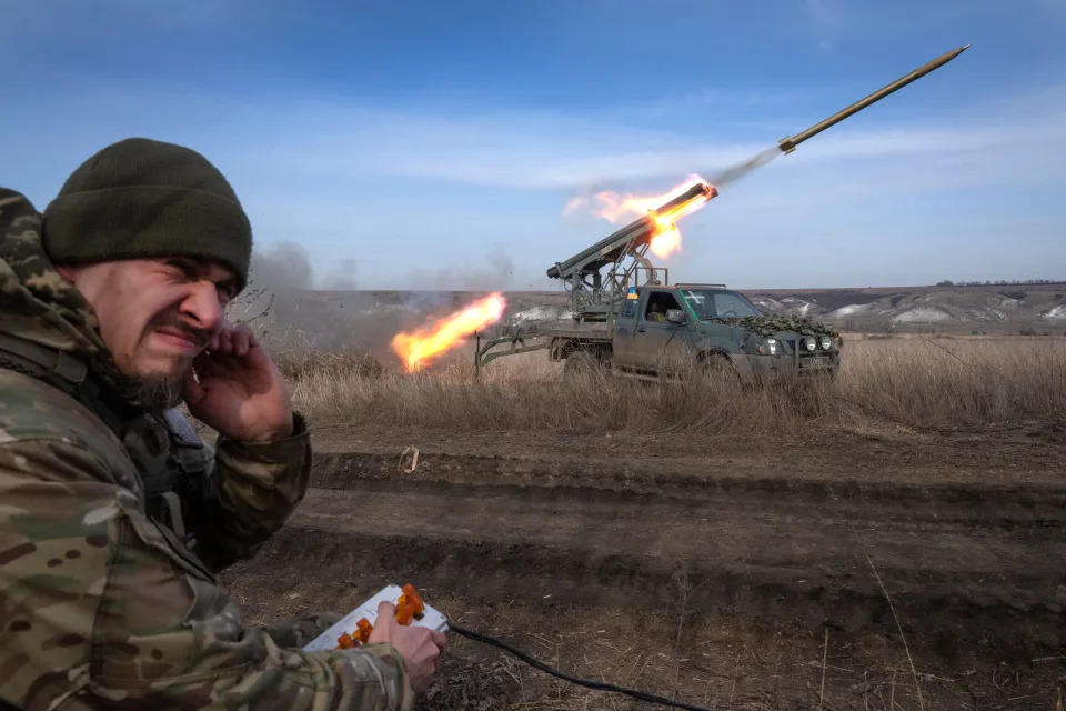 A Ukrainian officer from The 56th Separate Motorized Infantry Mariupol Brigade fires a multiple launch rocket system based on a pickup truck towards Russian positions at the front line, near Bakhmut, Donetsk region, Ukraine, Tuesday, March 5, 2024.