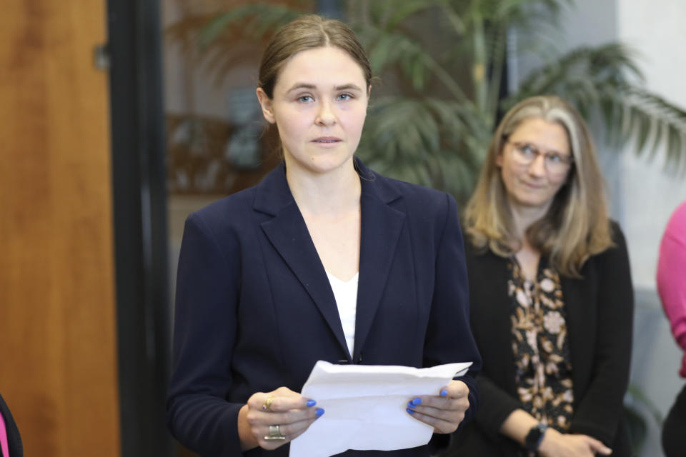 Taylor Shelton, who sued South Carolina over the definition of "heartbeat" under the state's 2023 abortion law,reads a statement after her case was argued in court on Thursday, May 2, 2024, in Columbia, S.C. (AP Photo/Jeffrey Collins)