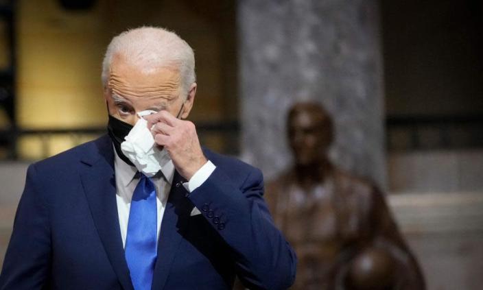 Biden wipes away a tear as he listens to Kamala Harris&#x002019;s speech.