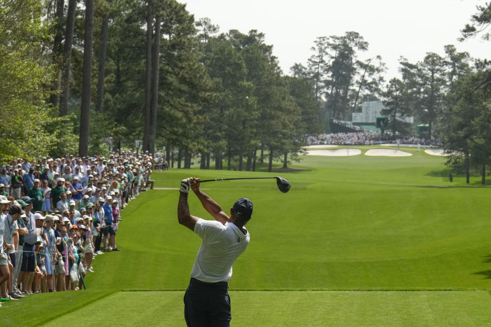 Tiger Woods watches his tee shot on the seventh hole during the first round of the Masters golf tournament at Augusta National Golf Club on Thursday, April 6, 2023, in Augusta, Ga. (AP Photo/Charlie Riedel)