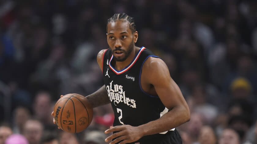 Los Angeles Clippers' Kawhi Leonard dribbles during the first half of an NBA basketball game against the Golden State Warriors Friday, March 17, 2023, in Los Angeles. (AP Photo/Jae C. Hong)