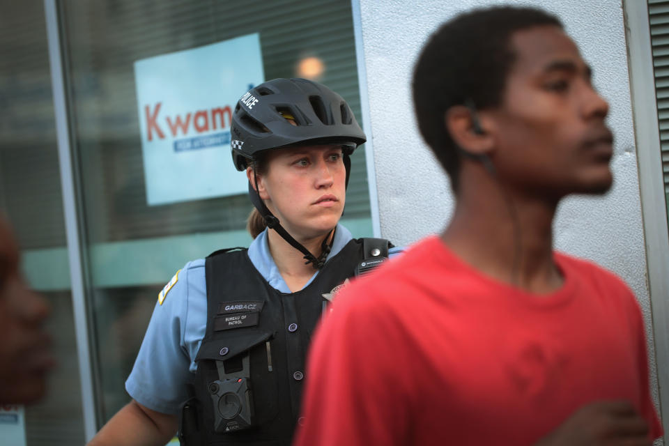 <p>Demonstrators rally in the South Shore neighborhood protesting the shooting death of 37-year-old Harith Augustus on July 16, 2018 in Chicago, Ill. (Photo: Scott Olson/Getty Images) </p>