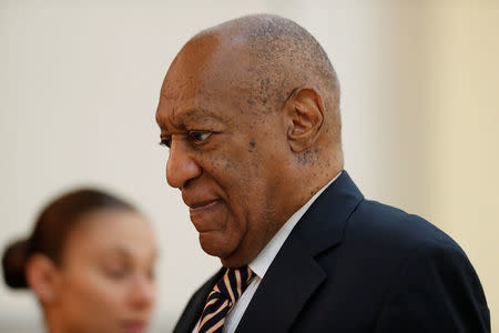 Actor and comedian Bill Cosby is helped through the metal detector as he arrives for the first day of his sexual assault trial at the Montgomery County Courthouse in Norristown, Pennsylvania, U.S. June 5, 2017. REUTERS/David Maialetti/Pool