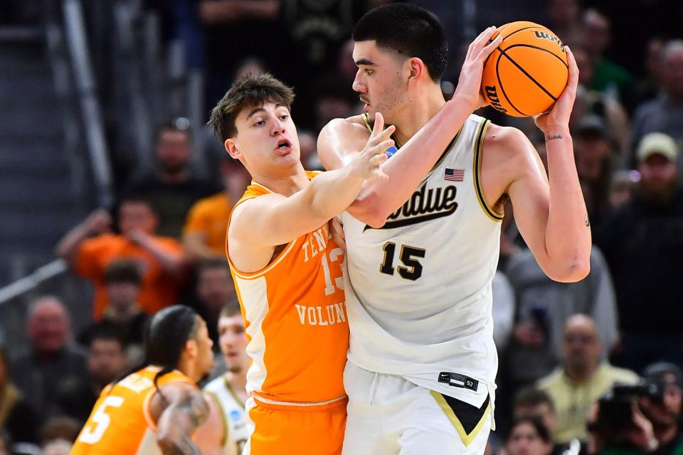 Tennessee forward J.P. Estrella (13) guarding Purdue center Zach Edey (15) during the NCAA Tournament Elite Eight college basketball game between at Little Caesars Arena in Detroit, MI on Sunday, March 31, 2024.