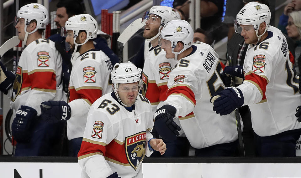 Florida Panthers' Evgenii Dadonov (63) is congratulated by teammates after scoring a goal against the San Jose Sharks in the first period of an NHL hockey game Monday, Feb. 17, 2020, in San Jose, Calif. (AP Photo/Ben Margot)