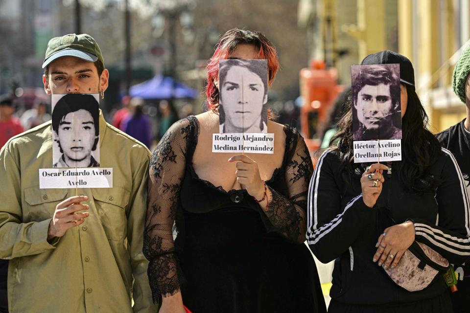 University students stage a peaceful protest on International Day of the Victims of Enforced Disappearance in Santiago on Aug. 30, 2023. Chile is marking the 50th anniversary the coup that brought Pinochet to power as the world remembers him as the dictator whose regime tortured, killed and disappeared thousands of people in the name of fighting communism.