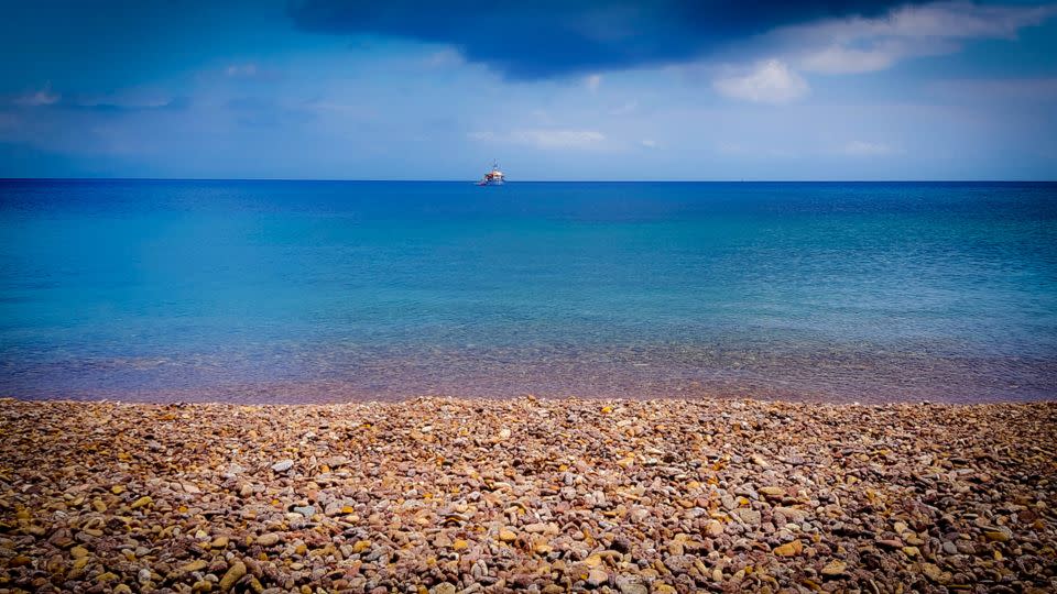 Lambi beach is covered with multi-colored pebbles. - John Malathronas