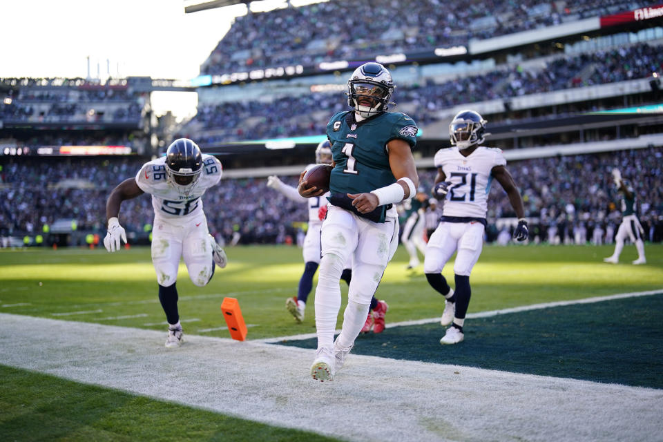 FILE — Philadelphia Eagles quarterback Jalen Hurts scores a touchdown against the Tennessee Titans during an NFL football game Dec. 4, 2022, in Philadelphia. (AP Photo/Matt Rourke, File)