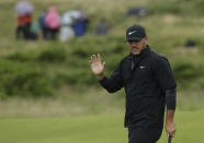 Brooks Koepka of the United States acknowledges the crowd after putting on the 9th green during the first round of the British Open Golf Championships at Royal Portrush in Northern Ireland, Thursday, July 18, 2019.(AP Photo/Matt Dunham)