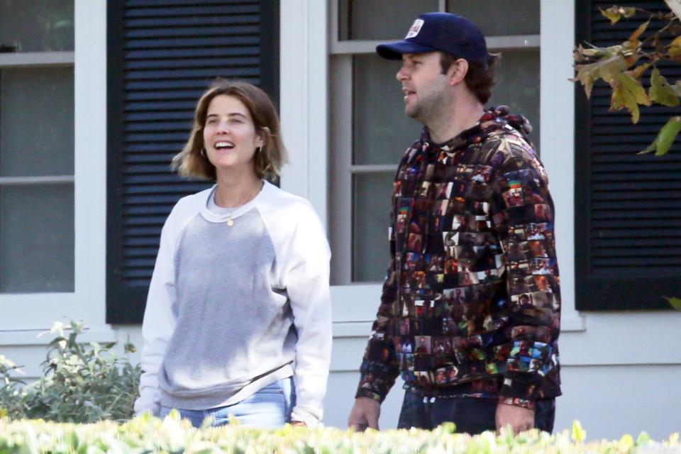 <p>Cobie Smulders and husband Taran Killam decorate their home in L.A. with Christmas lights on Tuesday.</p>