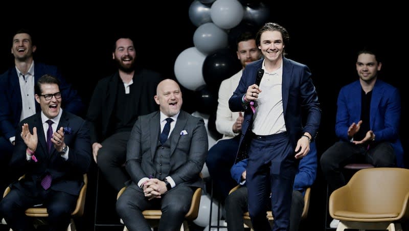 Members of the team react as Clayton Keller introduces himself to the fans during the NHL event at the Delta Center in Salt Lake City, as Utah’s NHL hockey team is introduced to fans on Wednesday, April 24, 2024.