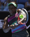 United States' Sloane Stephens makes a backhand return to compatriot Taylor Townsend during their first round match at the Australian Open tennis championships in Melbourne, Australia, Monday, Jan. 14, 2019. (AP Photo/Kin Cheung)