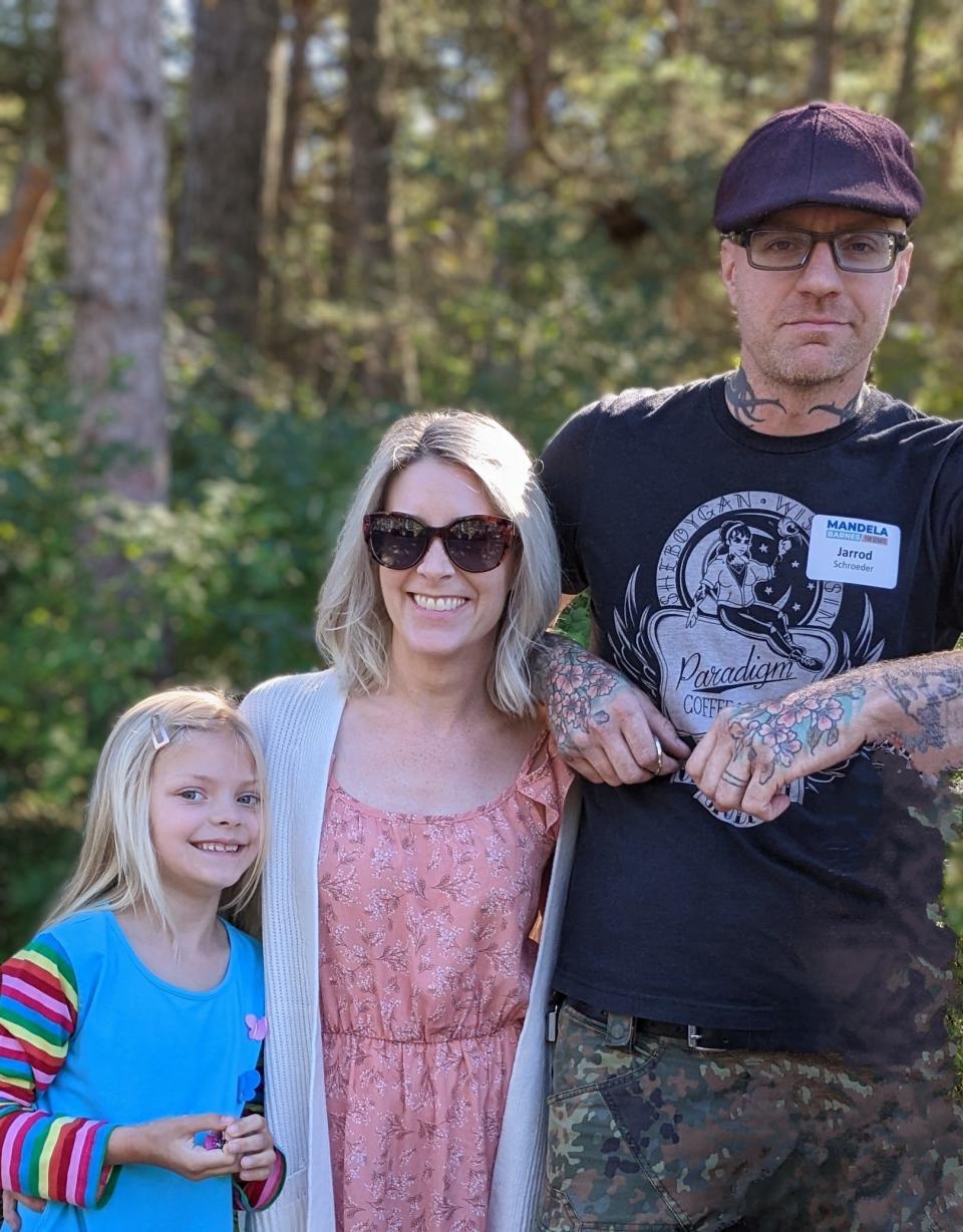 Jarrod Schroeder (right), a Democratic write-in candidate for Wisconsin Senate District 9, stands with his family.