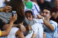 <p>Yarden Gerbi of Israel celebrates victory over Miku Tashiro of Japan with friends and family following the Women’s -63kg bronze medal a bout on Day 4 of the Rio 2016 Olympic Games at the Carioca Arena 2 on August 9, 2016 in Rio de Janeiro, Brazil. (Photo by Ryan Pierse/Getty Images) </p>