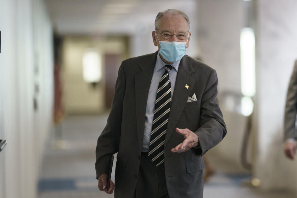 FILE - In this Oct. 26, 2020, file photo Sen. Chuck Grassley, R-Iowa arrives for a meeting at the Capitol in Washington. Grassley, the longest-serving Republican senator and third in the line of presidential succession, is back in the Senate on Monday, Nov. 30, after testing positive for coronavirus two weeks ago. (AP Photo/J. Scott Applewhite, File)