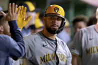 Milwaukee Brewers' Gary Sanchez is congratulated in the dugout after his home run against the Pittsburgh Pirates during the eighth inning of a baseball game Tuesday, April 23, 2024, in Pittsburgh. (AP Photo/Matt Freed)