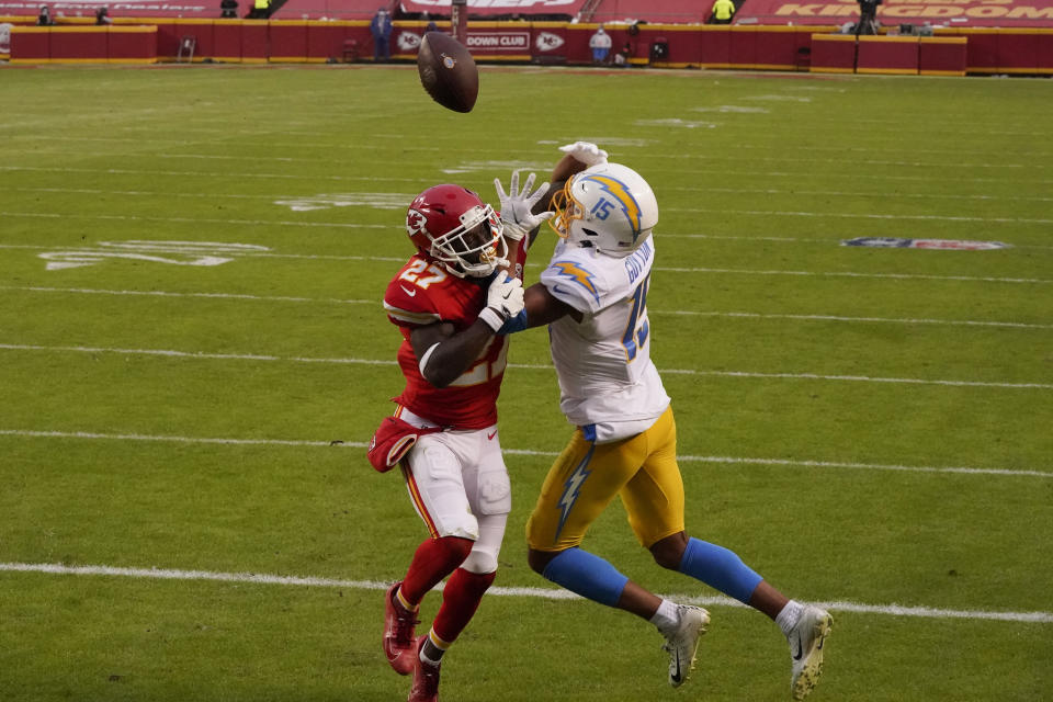 Kansas City Chiefs cornerback Rashad Fenton (27) breaks up a pass intended for Los Angeles Chargers wide receiver Jalen Guyton (15) during the first half of an NFL football game, Sunday, Jan. 3, 2021, in Kansas City. (AP Photo/Charlie Riedel)