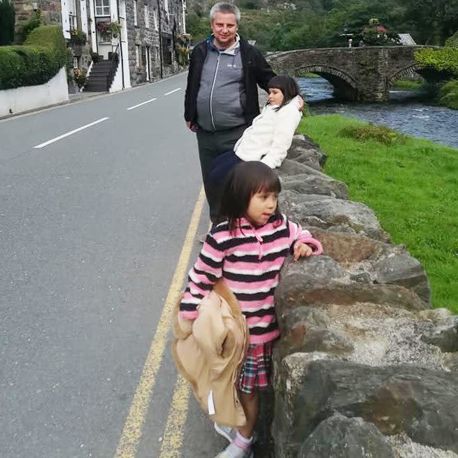 Bartlomiej Kuczynski, pictured with his daughters