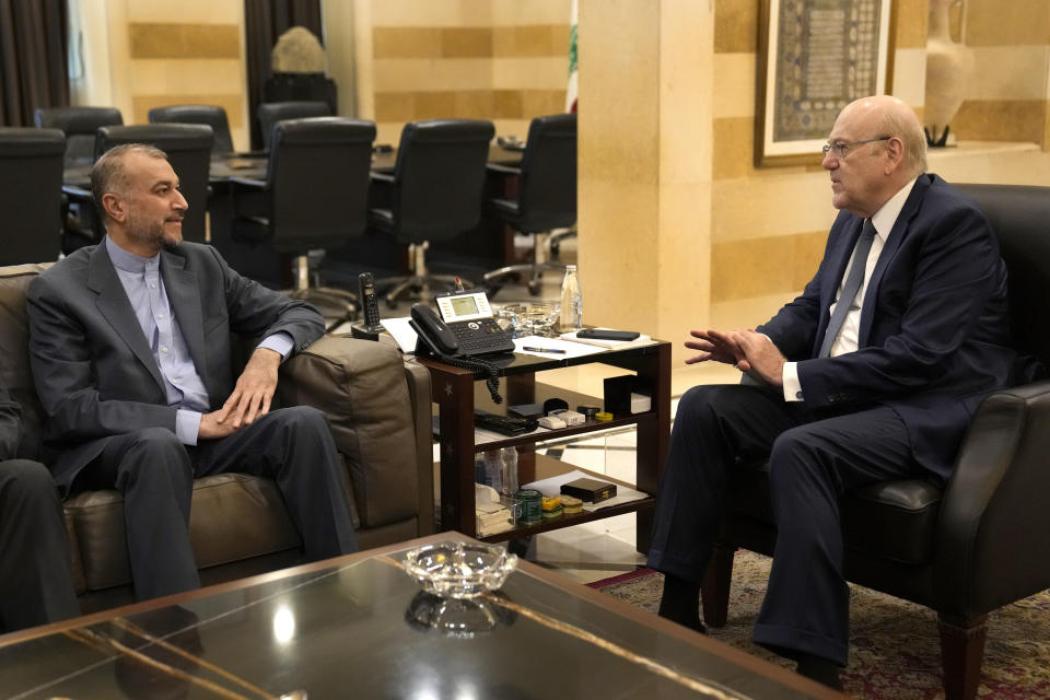 Lebanese Prime Minister Najib Mikati, right, meets with the Iranian Foreign Minister Hossein Amirabdollahian, in Beirut Lebanon, Friday, Oct. 13, 2023. Amirabdollahian blasted the United States for calling for restraint in the region while at the same time allowing Israel to "commit out crimes" in Gaza. (AP Photo/Hussein Malla)