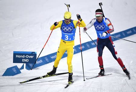 Biathlon - Pyeongchang 2018 Winter Olympics - Men's 4x7.5 km Relay Final - Alpensia Biathlon Centre - Pyeongchang, South Korea - February 23, 2018 - Fredrik Lindstroem of Sweden and Emil Hegle Svendsen of Norway compete. REUTERS/Toby Melville