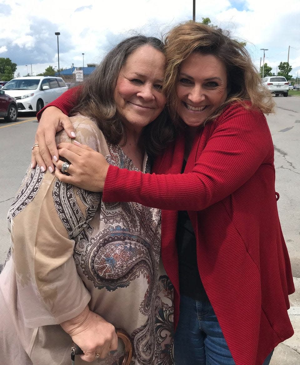 Dana Wright, on the right, hugs her mother, Linda Wright, who is hoping for the return of numerous items of property that she hasn't seen since they were taken away June 21 from her Topeka home by a Miami-based moving company.