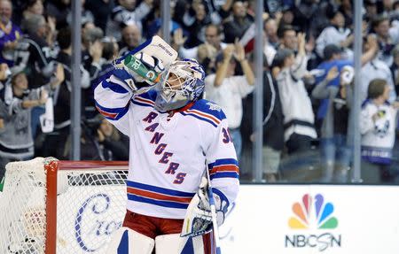 Jun 13, 2014; Los Angeles, CA, USA; New York Rangers goalie Henrik Lundqvist (30) takes a drink after giving up a goal to Los Angeles Kings right wing Justin Williams (not pictured) during the first period in game five of the 2014 Stanley Cup Final at Staples Center. Gary A. Vasquez-USA TODAY Sports