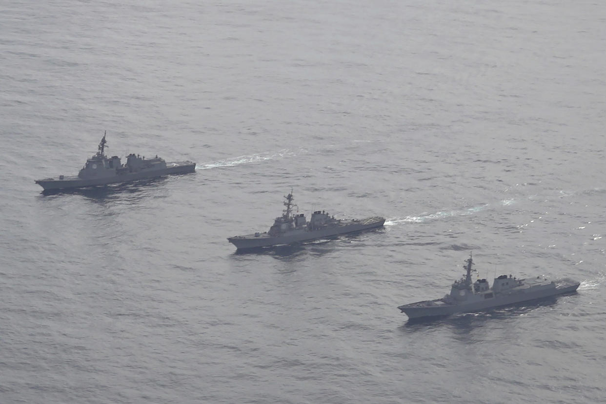 FILE - In this photo provided by South Korea Defense Ministry, Japan Maritime Self-Defense Force's destroyer Atago, left, U.S. Navy's Arleigh Burke-class guided-missile destroyer USS Barry, center, and South Korean Navy's Aegis destroyer King Sejong the Great, right, sail during a joint missile defense drill among South Korea, the United States and Japan in the international waters of the east coast of Korean peninsular, on Feb. 22, 2023. The United States, South Korea and Japan will conduct a joint missile defense exercise in waters near the Korean Peninsula on Monday, April 17, 2023 as they further expand military training to counter the growing threats of North Korea’s nuclear-capable missiles, the South Korean navy said. (South Korea Defense Ministry via AP, File)