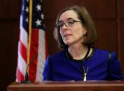 Oregon Governor Kate Brown speaks at the state capital building in Salem