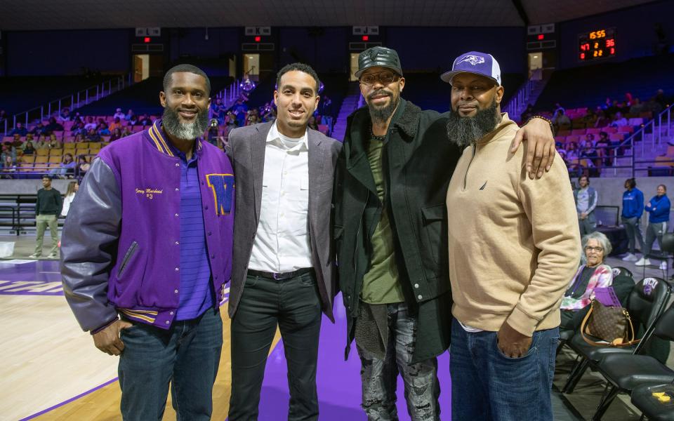 Zanesville High School grad Kevin Martin, second from left, stands for a photo with former Western Carolina teammates Corey Muirhead, left, Terrence Woodyard and Cory Largent prior to Martin's jersey retirement ceremony on Dec. 9, 2023, at the Ramsey Center in Cullowhee, N.C. Martin averaged more than 20 points per game each season with the Catamounts before playing 12 years in the NBA.