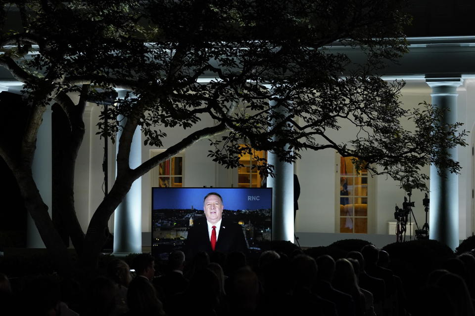 A video of Secretary of State Mike Pompeo speaking during the Republican National Convention plays from the Rose Garden of the White House, Tuesday, Aug. 25, 2020, in Washington. (AP Photo/Evan Vucci)