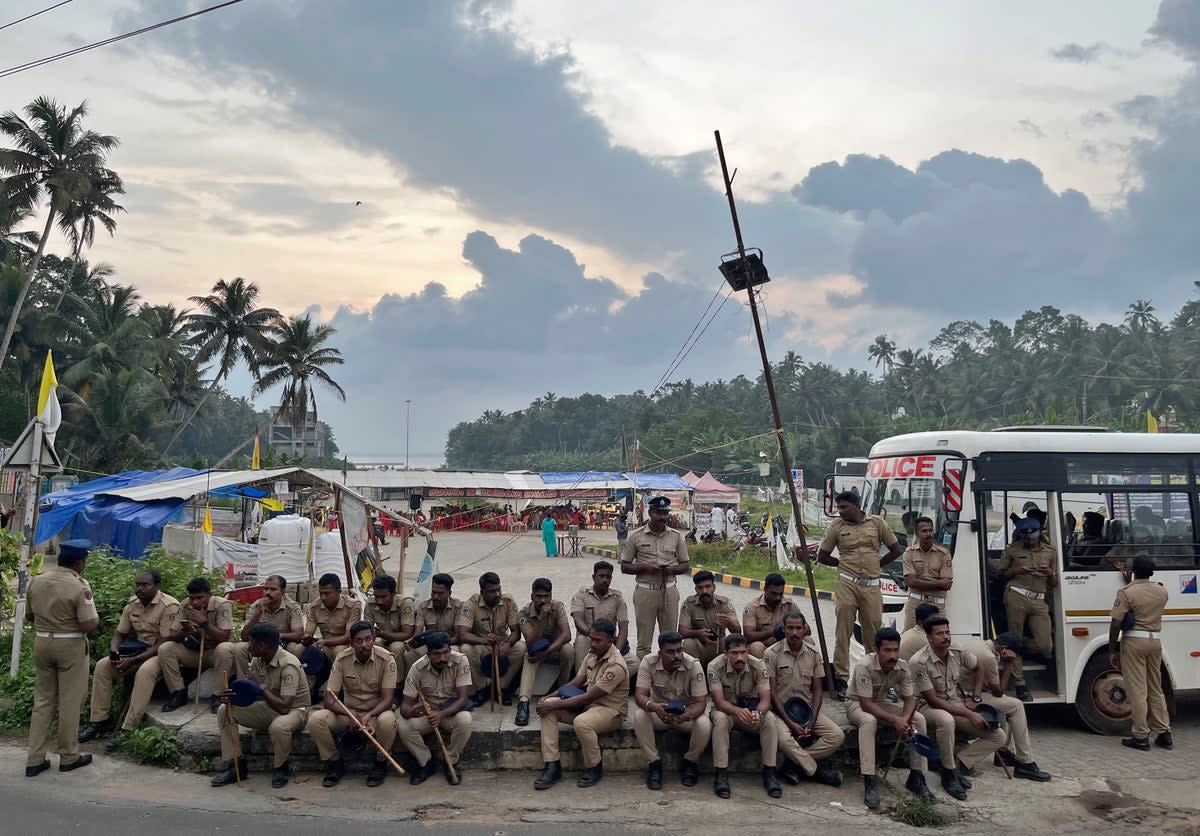 Police officers are deployed as fishermen protest near the entrance of the proposed Vizhinjam Port in Kerala (Reuters)