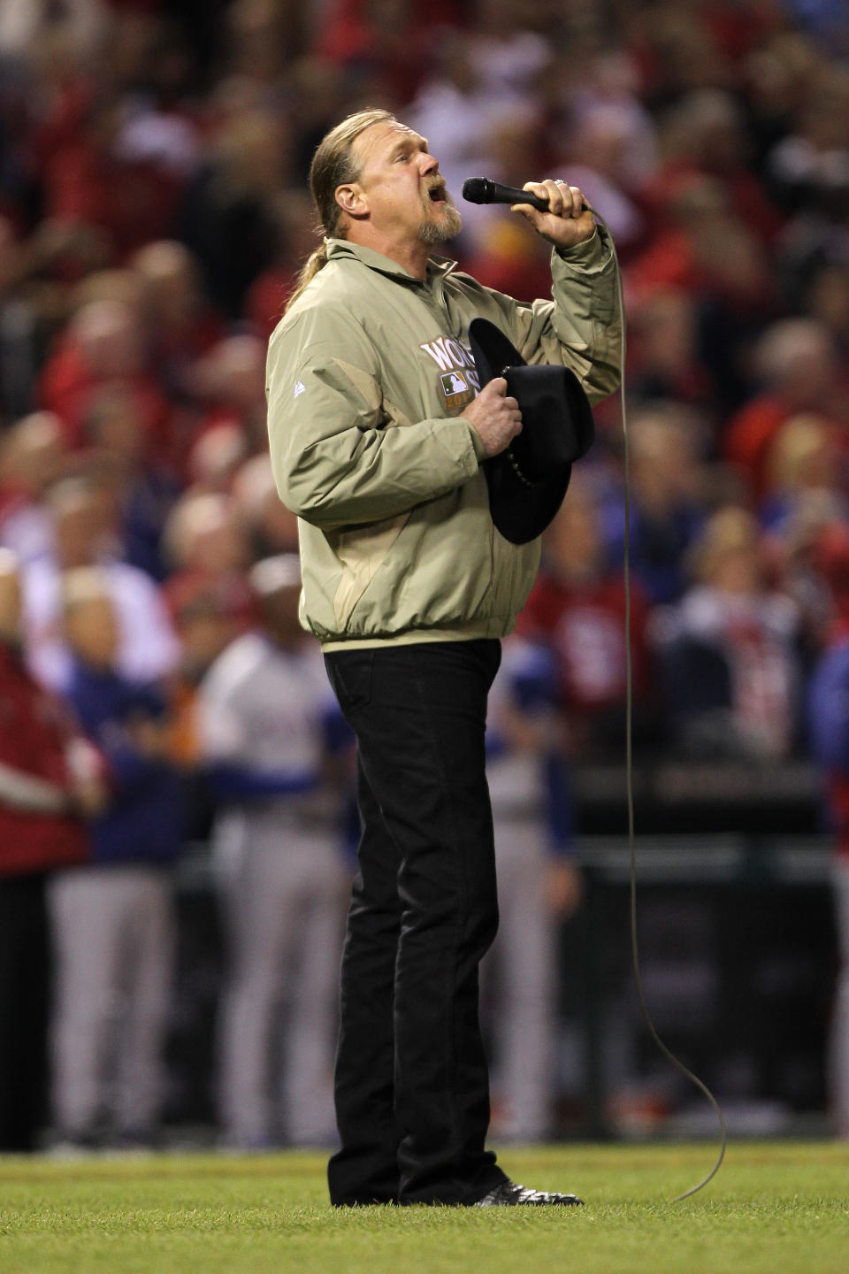 ST LOUIS, MO - OCTOBER 20: Country star Trace Atkins sings the national anthem prior to Game Two of the MLB World Series between the Texas Rangers and the St. Louis Cardinals at Busch Stadium on October 20, 2011 in St Louis, Missouri. (Photo by Ezra Shaw/Getty Images)