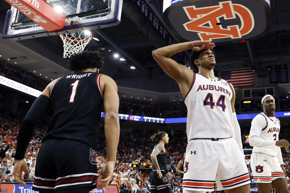 Auburn center Dylan Cardwell (44) reacts after blocking the shot of South Carolina guard Jacobi Wright (1) during the first half of an NCAA college basketball game Wednesday, Feb. 14, 2024, in Auburn, Ala. (AP Photo/Butch Dill)