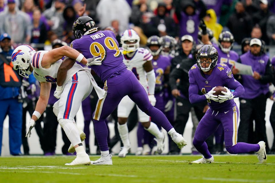 Baltimore Ravens cornerback Marlon Humphrey (44) intercepts a pass against the Buffalo Bills in the first half of an NFL football game Sunday, Oct. 2, 2022, in Baltimore. (AP Photo/Julio Cortez)
