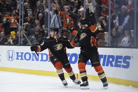 Nov 15, 2017; Anaheim, CA, USA; Anaheim Ducks left wing Kevin Roy (left) and center Antoine Vermette (50) celebrate a goal by left wing Nick Ritchie (not pictured) against the Boston Bruins during the second period at Honda Center. Kelvin Kuo-USA TODAY Sports