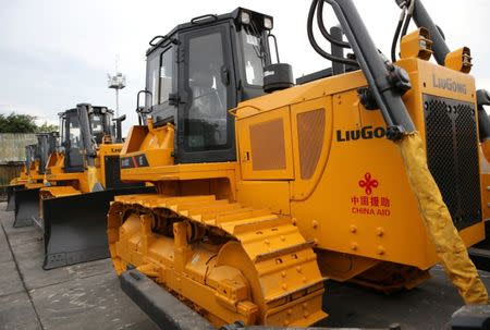 Bulldozers donated by China, that will aid in the rehabilitation of the war-torn Marawi city, are seen in the port of Iligan city, southern Philippines October 19, 2017. REUTERS/Romeo Ranoco