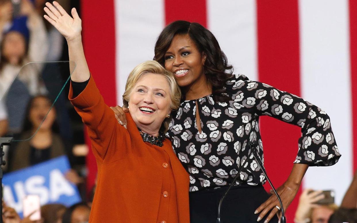 Mrs Obama with Hillary Clinton during the campaign - EPA