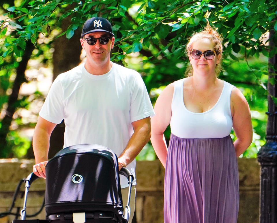 NEW YORK, NY - MAY 18:  Amy Schumer and Chris Fischer take baby Gene Attell Fischer and their dog to the park on May 18, 2019 in New York City.  (Photo by Gotham/GC Images)