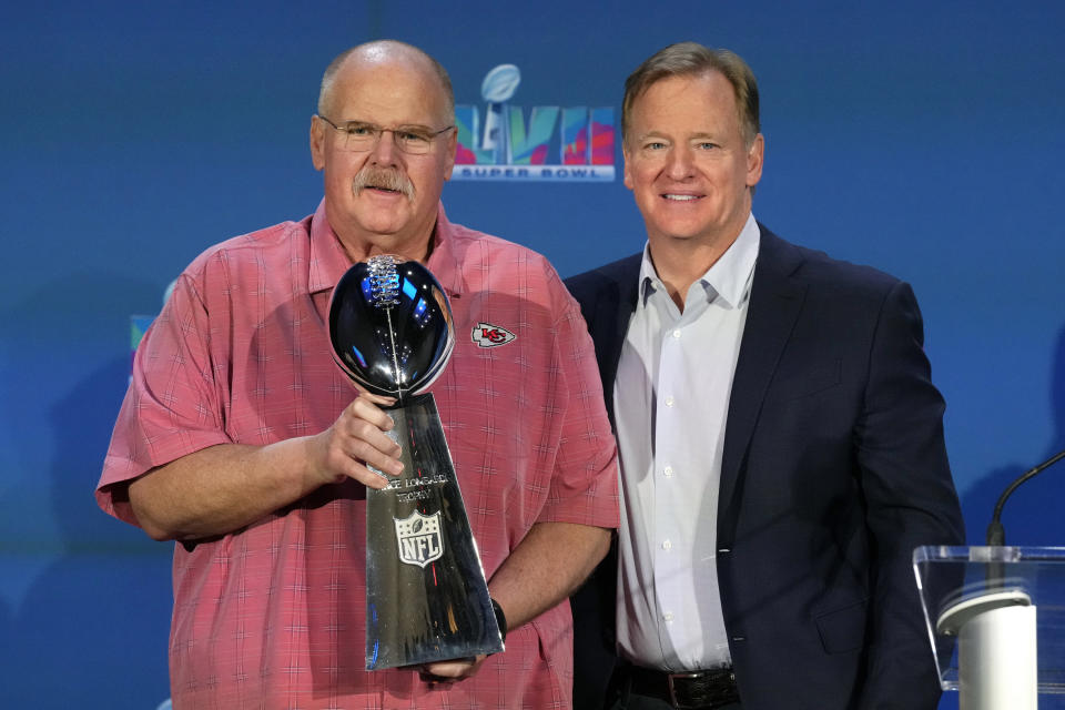 Kansas City Chiefs head coach Andy Reid, left, holds up the Vince Lombardi Trophy as he stands next to NFL Commissioner Roger Goodell during an NFL Super Bowl football news conference in Phoenix, Monday, Feb. 13, 2023. The Chiefs defeated the Philadelphia Eagles 38-35 in Super Bowl LVII. (AP Photo/Ross D. Franklin)